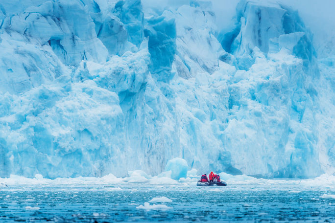 An expedition on Zodiacs views the 4th of July Glacier in Spitsbergen, Svalbard. expeditions, Zodiacs, glacier, Arctic, Svalbard, Spitsbergen, abercrombie & kent, a&k