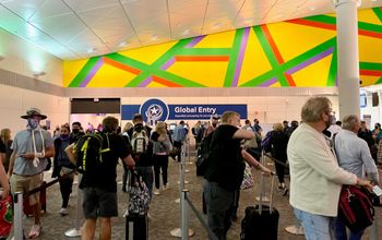 A view of Global Entry kiosks through a long line at Dallas Fort Worth airport