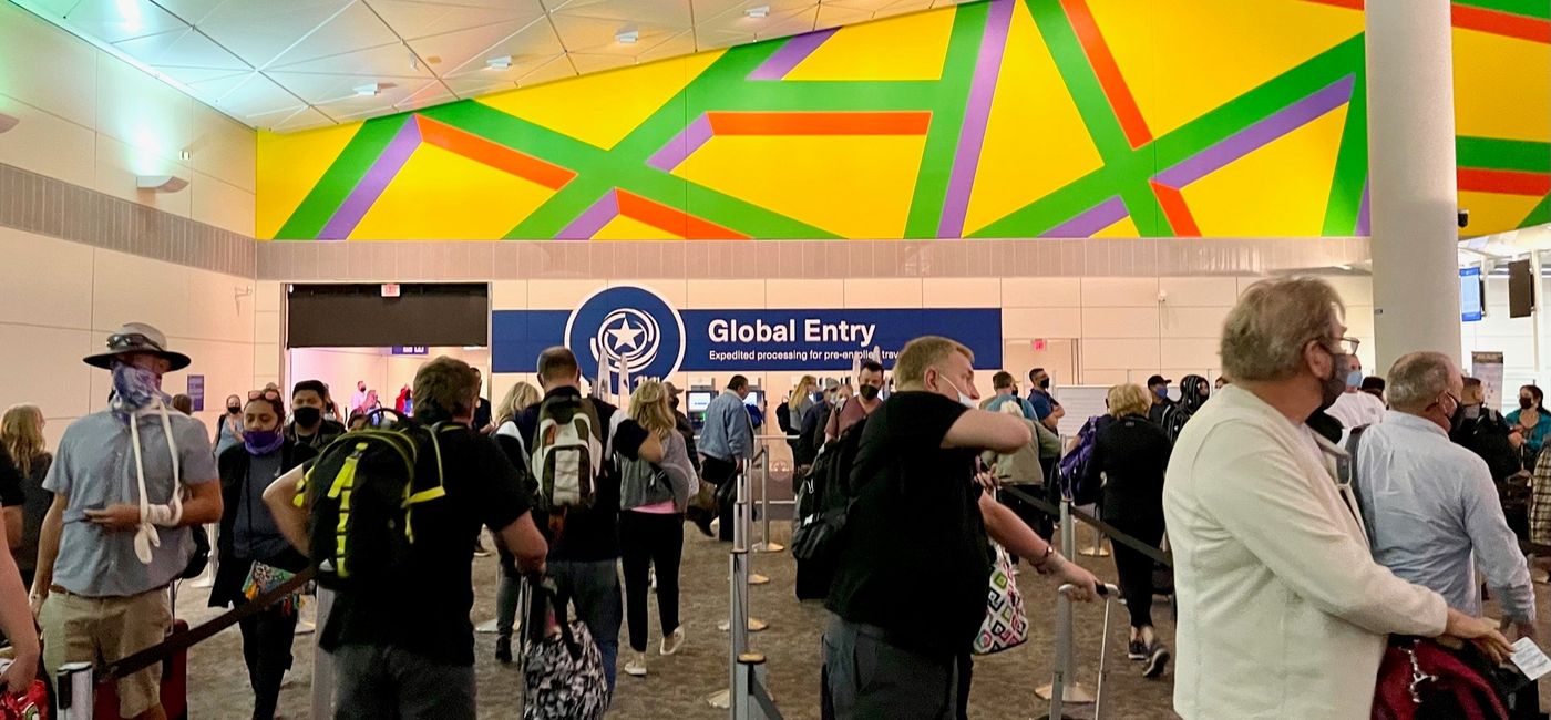 Image: A view of Global Entry kiosks through a long line at Dallas Fort Worth airport. (photo by Codie Liermann)