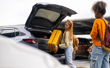 Traveler checking into a rental car