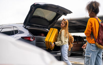 Traveler checking into a rental car