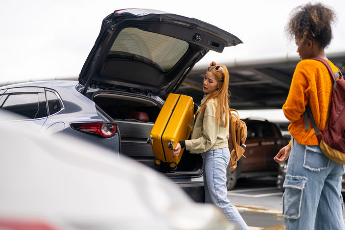 Traveler checking into a rental car Traveler checking into a rental car