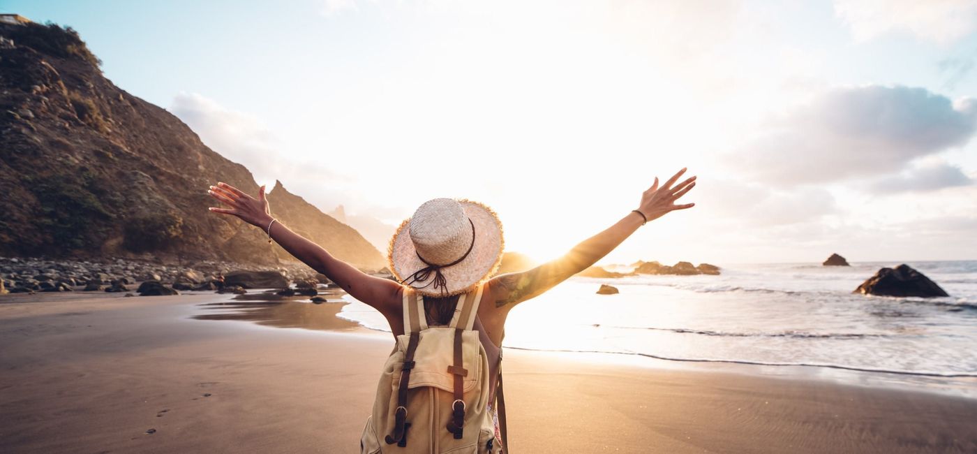 Image: Traveler, woman, beach, coast, sunrise, sunset (Photo Credit: Expedia)