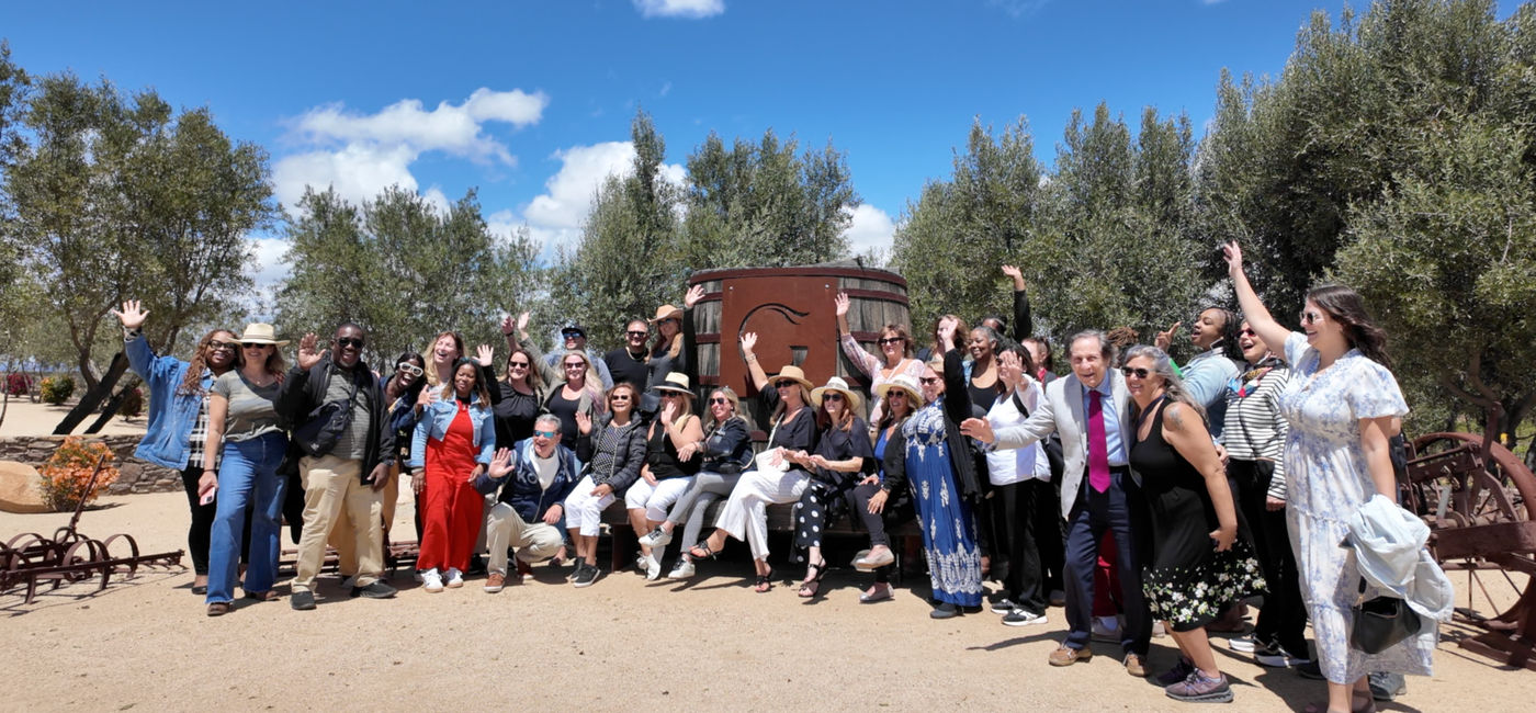 Photo: Travel advisors pose at a winery in Baja California, Mexico (Photo Credit: Eric Bowman)