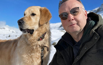 Philippe Benoist, founder of MyDogCanFly.com, with golden retriever, Bailey.