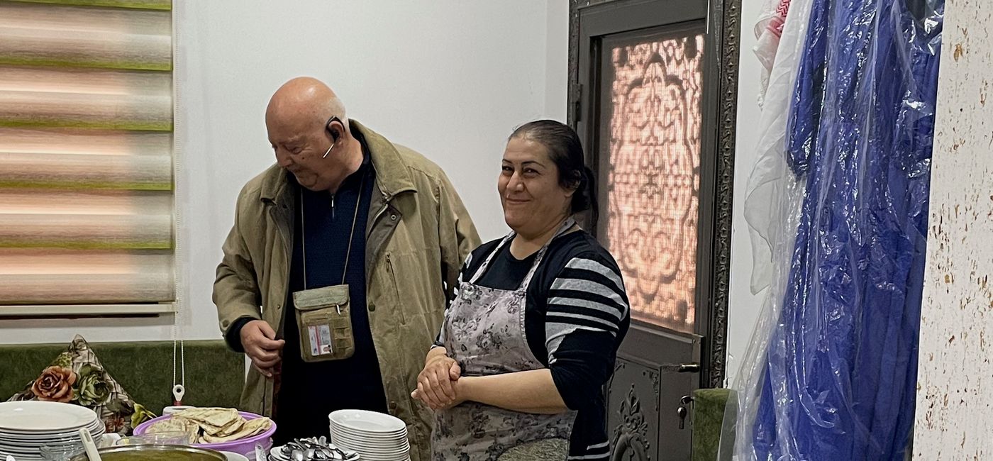 Image: Enjoying a home-cooked meal in Jordan. (Photo Credit: Bruce Parkinson)
