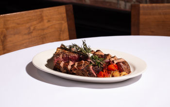 Grilled tomahawk steak at a fine dining restaurant
