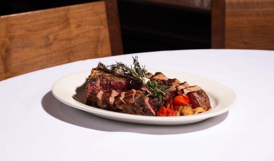 Grilled tomahawk steak at a fine dining restaurant