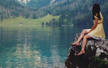 Woman on a rock at a lake