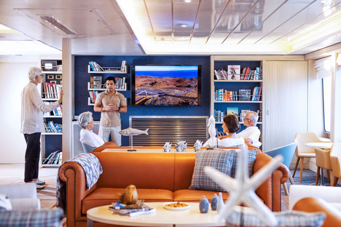 The ship is filled with bright and airy spaces, including the library and Science Center