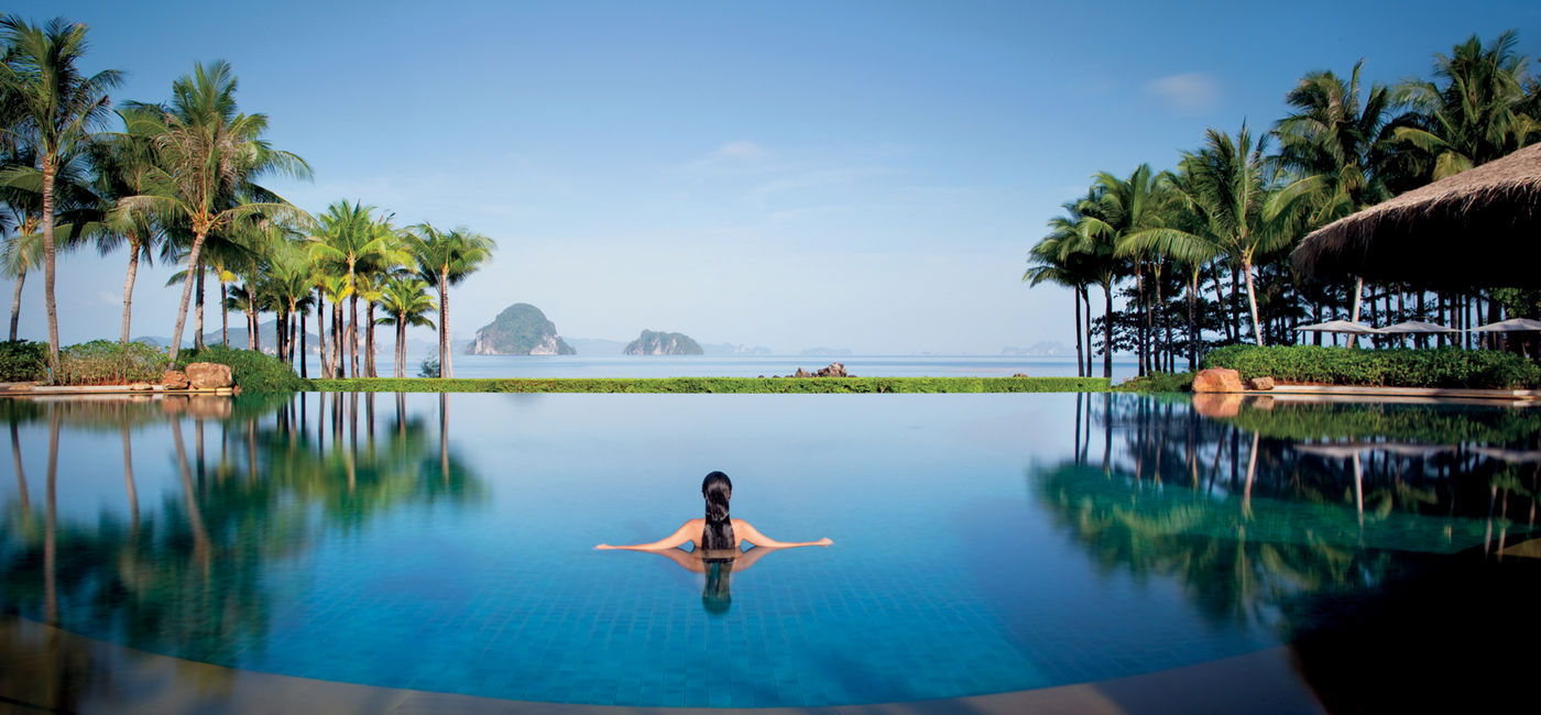 Image: A woman swims at Phulay Bay, a Ritz-Carlton Reserve, which is now part of The Outdoor Collection by Marriott Bonvoy. (Photo Credit: Marriott Bonvoy)