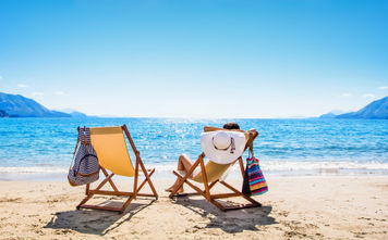 Woman lounging on the beach