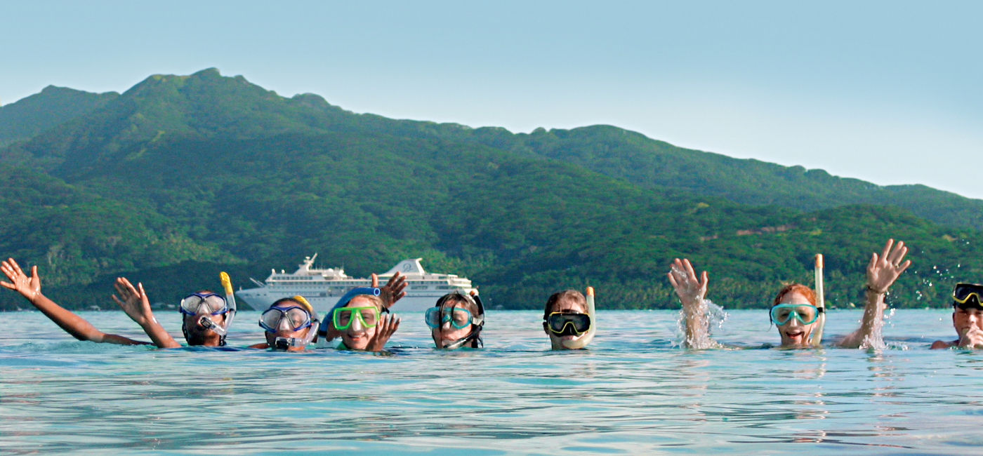 Image: Kids can snorkel with a guide in the South Pacific with Paul Gauguin's Moana Explorer Program sailings. (Photo Credit: Paul Gauguin Cruises)