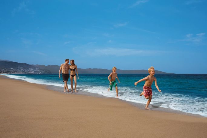 Family on the beach at Dreams Vallarta Bay Family on the beach at Dreams Vallarta Bay