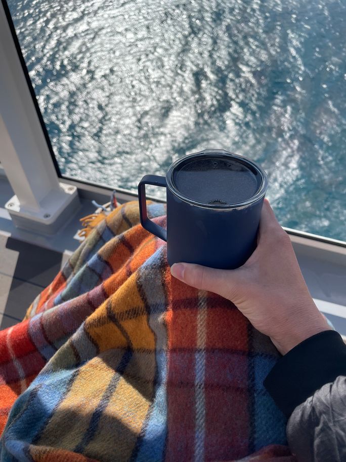 Enjoying a sunny day with a coffee on National Geographic Endurance