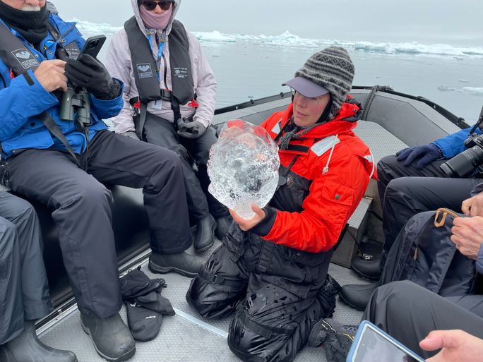 Expedition guide Kerstin Langenberger explains the difference between glacial ice and sea ice on a Zodiac cruise Expedition guide Kerstin Langenberger explains the difference between glacial ice and sea ice on a Zodiac cruise