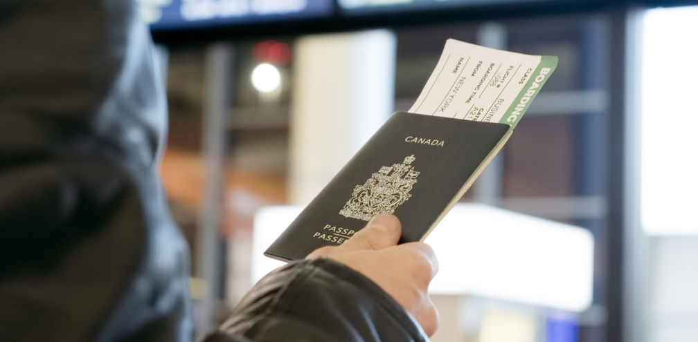 Man with Canadian passport and boarding pass