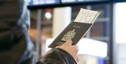 Man with Canadian passport and boarding pass