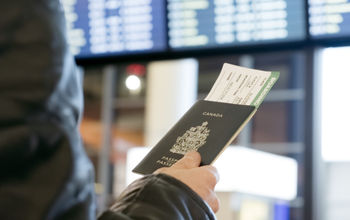 Man with Canadian passport and boarding pass