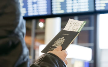 Man with Canadian passport and boarding pass
