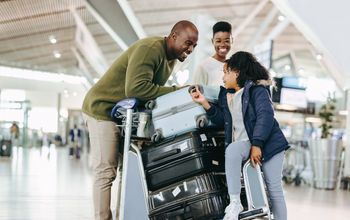 Family preparing for travel at the airport