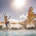 Families at the pool at Sunscape Cancun