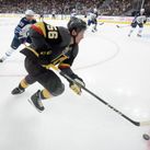 Vegas Golden Knights left wing Erik Haula (56) is chased by Winnipeg Jets defenseman Toby Enstrom (39) during Game 4 of their NHL hockey Western Conference Final game Friday, May 18, 2018, at T-Mobile Arena.