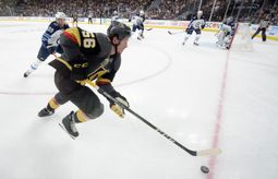 Vegas Golden Knights left wing Erik Haula (56) is chased by Winnipeg Jets defenseman Toby Enstrom (39) during Game 4 of their NHL hockey Western Conference Final game Friday, May 18, 2018, at T-Mobile Arena.