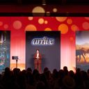 Global Travel Collection President Angie Licea welcomes attendees to ARRIVE.