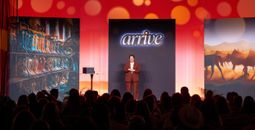 Global Travel Collection President Angie Licea welcomes attendees to ARRIVE.