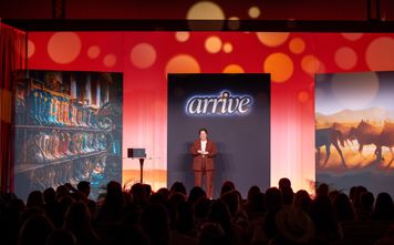 Global Travel Collection President Angie Licea welcomes attendees to ARRIVE.