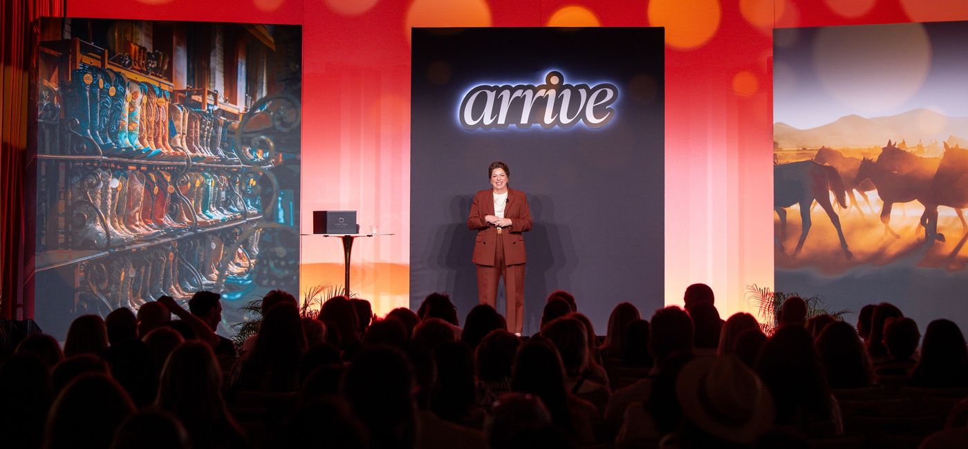 Image: Global Travel Collection President Angie Licea welcomes attendees to ARRIVE. (Photo Credit: Global Travel Collection)