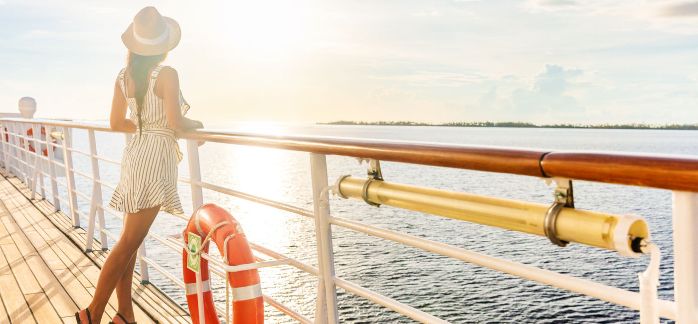 Image: Woman on a cruise ship. (Photo Credit: Maridav/Adobe)