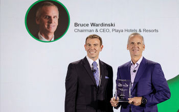 Playa's Bruce Wardinski accepts his award