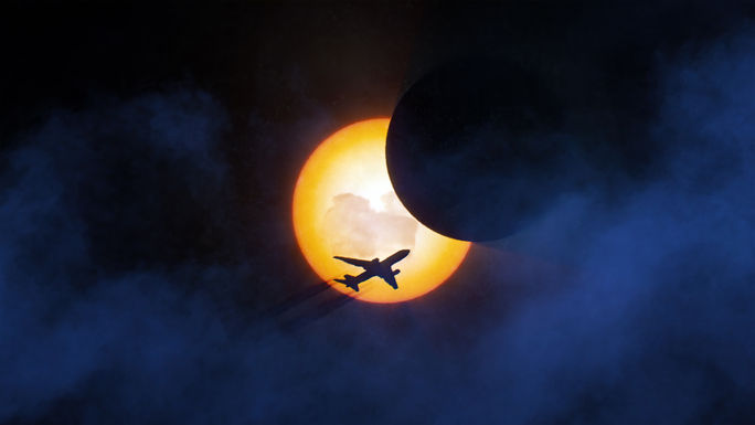 Airplane flying during a solar eclipse 