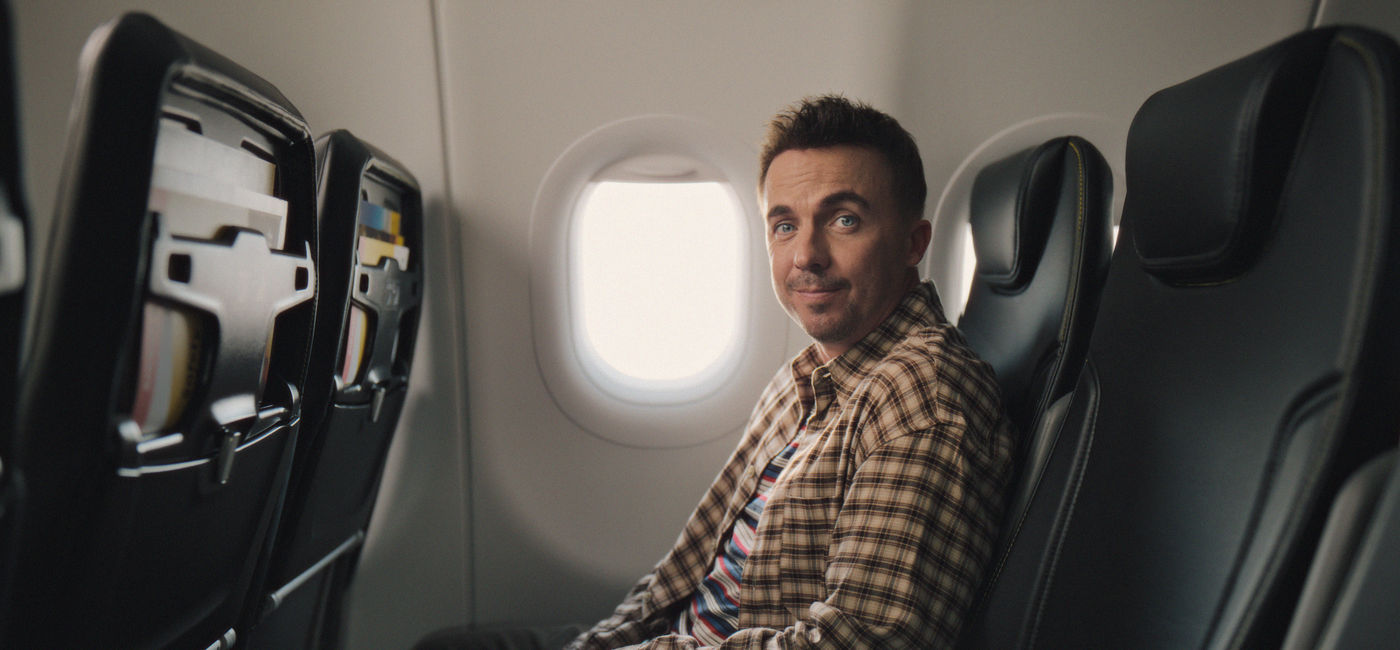Image: "Malcolm in the Middle" star Frankie Muniz shows off the Go Comfy seating option in Spirit's new #NotInTheMiddle campaign. (Photo Credit: Spirit Airlines)