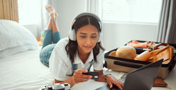 A woman booking travel with a credit card