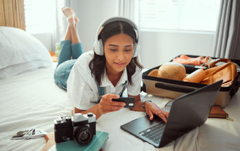 A woman booking travel with a credit card