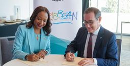 Dona Regis-Prosper and Dr. Rafael Echevarne sign MOU