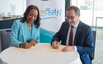Dona Regis-Prosper and Dr. Rafael Echevarne sign MOU