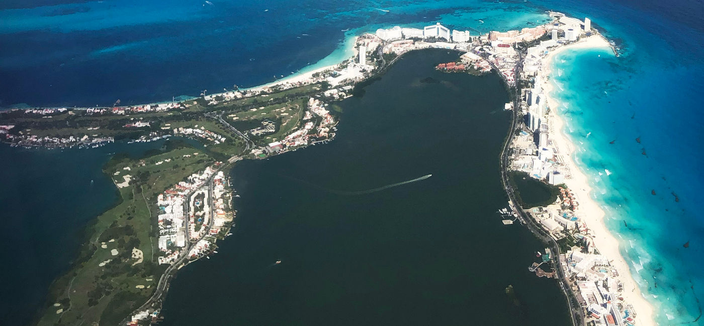 Image: An aerial view of Cancun's hotel zone (Zona Hotelera) and Laguna Bojorquez. (Photo Credit: Photo by Paul J. Heney.)