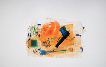 Xray of luggage with a hidden pistol, TSA, gun, handgun, firearm, airport,