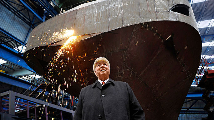 Viking Cruises founder and chairman Torstein Hagen in front of a Viking Longship under construction Viking Cruises, Torstein Hagen, Viking Longship, river, cruise