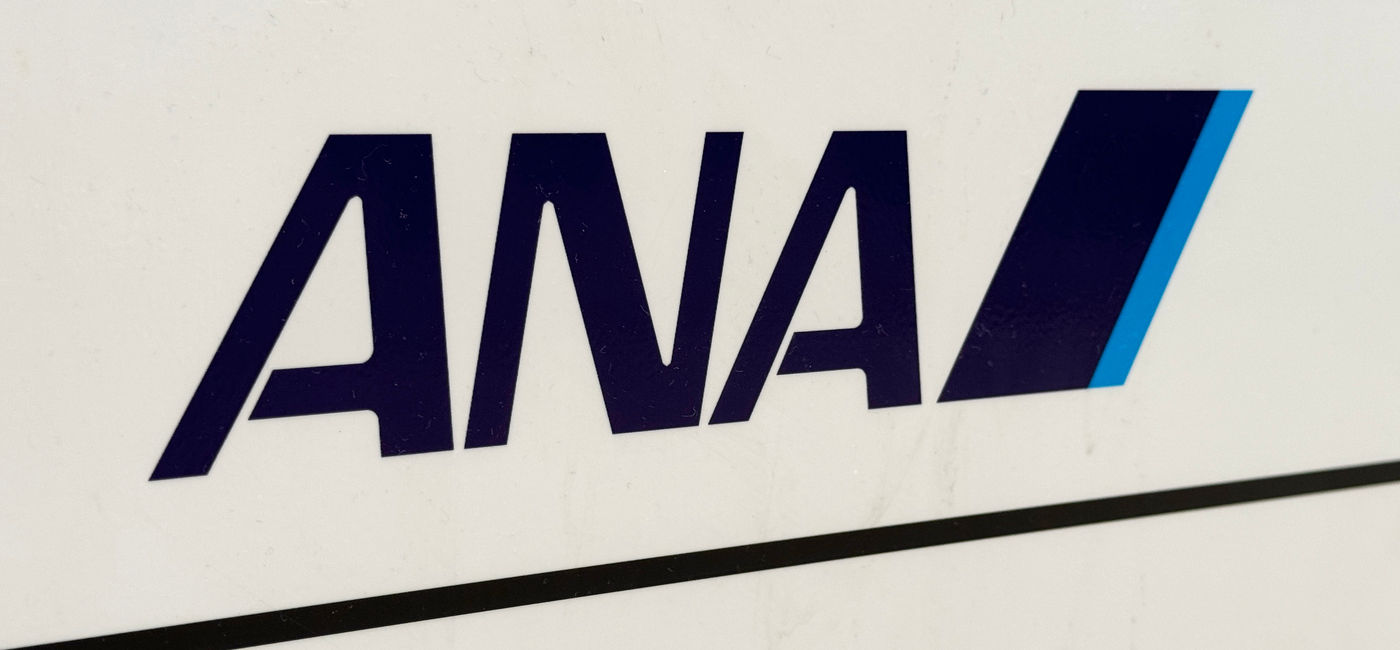 Image: ANA (All Nippon Airways) company logo at airport. (Photo Credit: Robert / Adobe Stock)