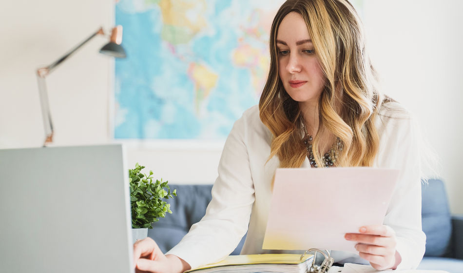 A travel advisor working on her computer.