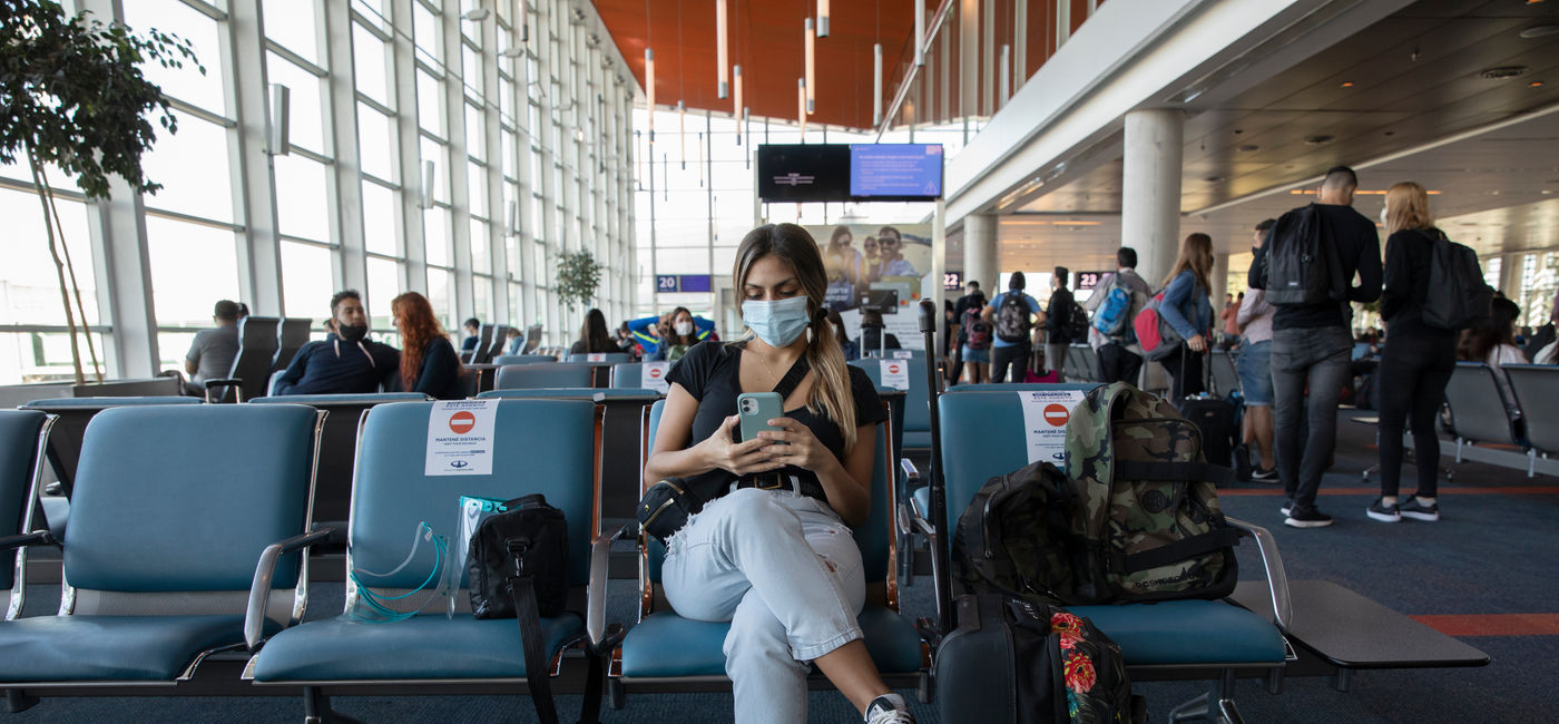 Image: Traveler at an airport during COVID-19. (Photo Credit: Courtesy AdobeStock)