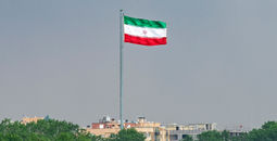 Iranian flag from Khaju Bridge over the Zayandeh River.