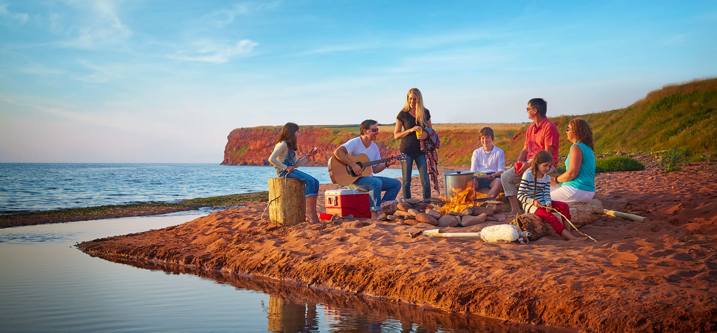 Image: A family campfire on the beach in PEI (Photo Credit: ©Tourism PEI / Yvonne Duivenvoorden)