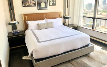 Hotel bed in bright airy room