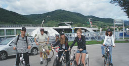 Family cycling on a shore excursion in Durnstein